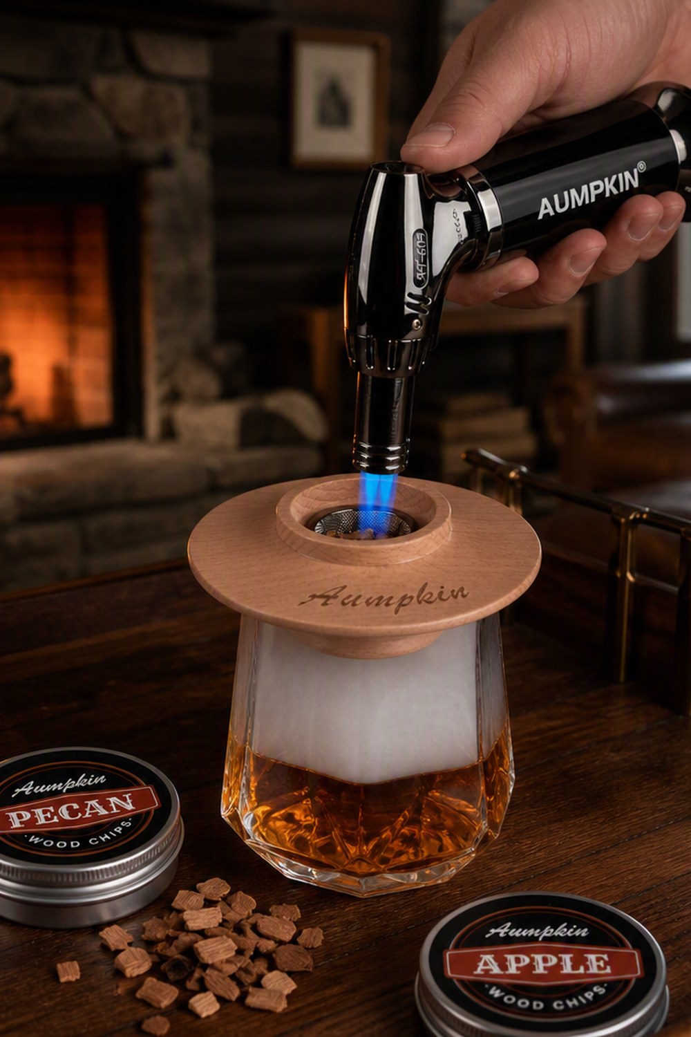 Beech wood cocktail smoker disc on a smoke-filled whiskey glass by a stone fireplace in a cabin den