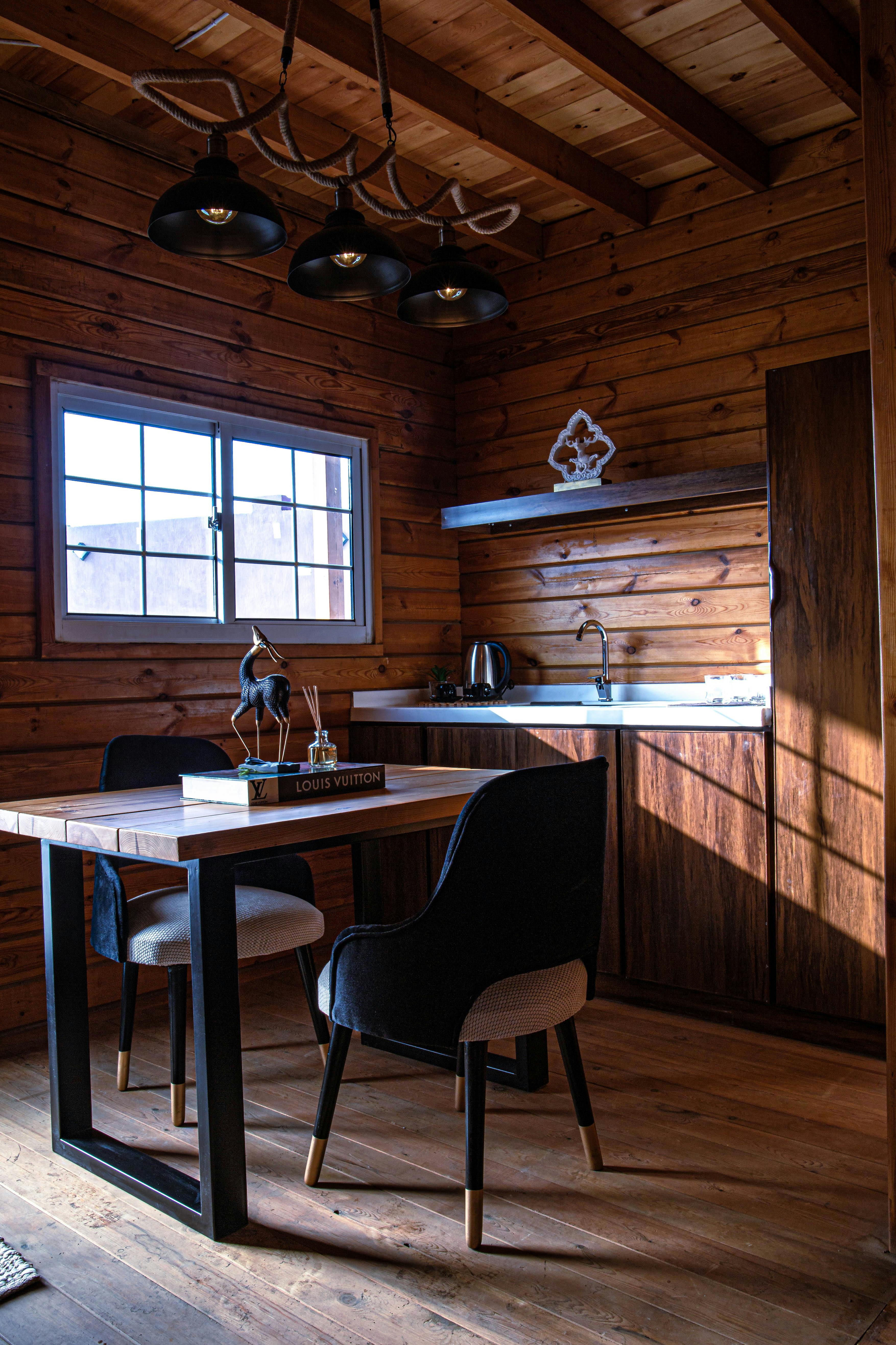 Cozy modern cabin interior bathed in warm evening light
