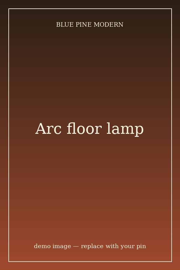 Black arc floor lamp by a chair